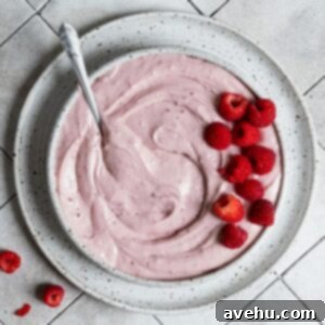 Raspberry Jam Cream Cheese Frosting 3 Raspberry cream cheese frosting in a bowl topped with fresh raspberries