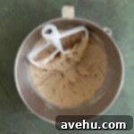 Deliciously Simple Gingerbread Bundt 3 Creamed brown butter and sugar in a bowl.