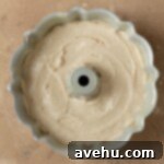 Cinnamon bundt cake batter in a bundt pan.