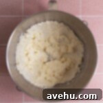 Butter and sugar mixed and creamed in a mixing bowl.