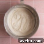 Vanilla cake batter in a mixing bowl.