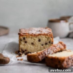 Effortless Chocolate Chip Pound Cake Without Sour Cream 2 Chocolate chip loaf cake with 2 slices cut out.