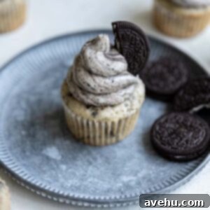One Oreo Cupcake on a blue plate garnished with an Oreo.