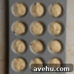 Pure Banana Indulgence Cupcakes 6 Banana cupcake batter in a cupcake tin.