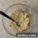 Pure Banana Indulgence Cupcakes 3 Mashed banana in a glass bowl.