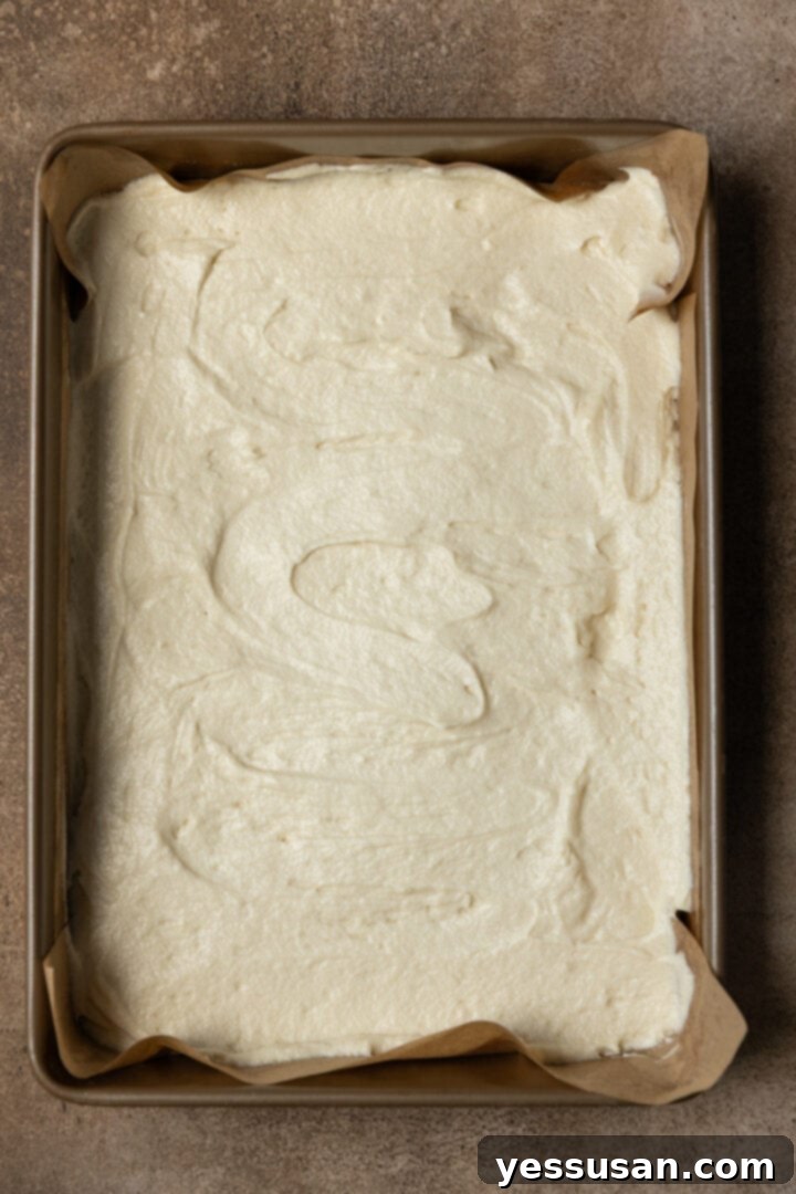 Fluffy Golden Butter Cake 7 Smooth butter cake batter evenly spread in a greased 9x13 inch baking pan.