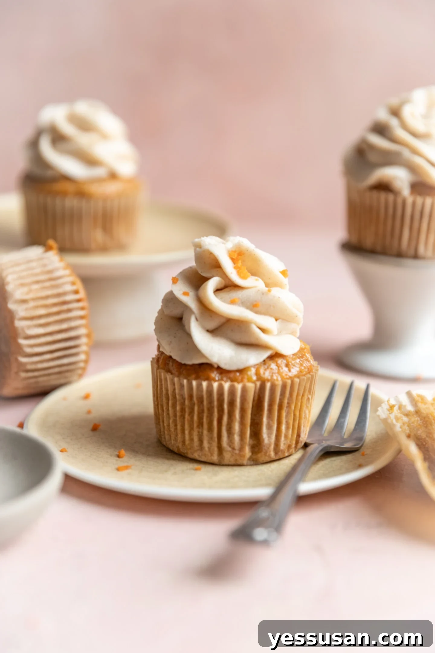 Pineapple-Packed Carrot Cupcake Delights 2 Carrot cake cupcakes frosted with cinnamon cream cheese frosting.