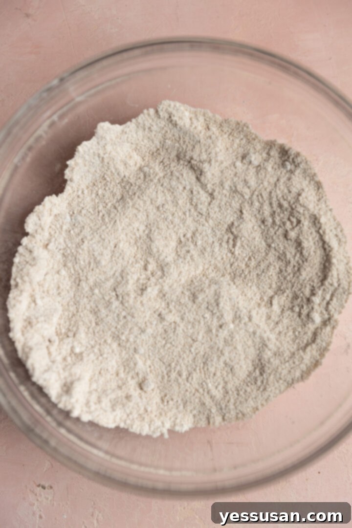 Pineapple-Packed Carrot Cupcake Delights 3 Dry ingredients whisked together in a bowl.