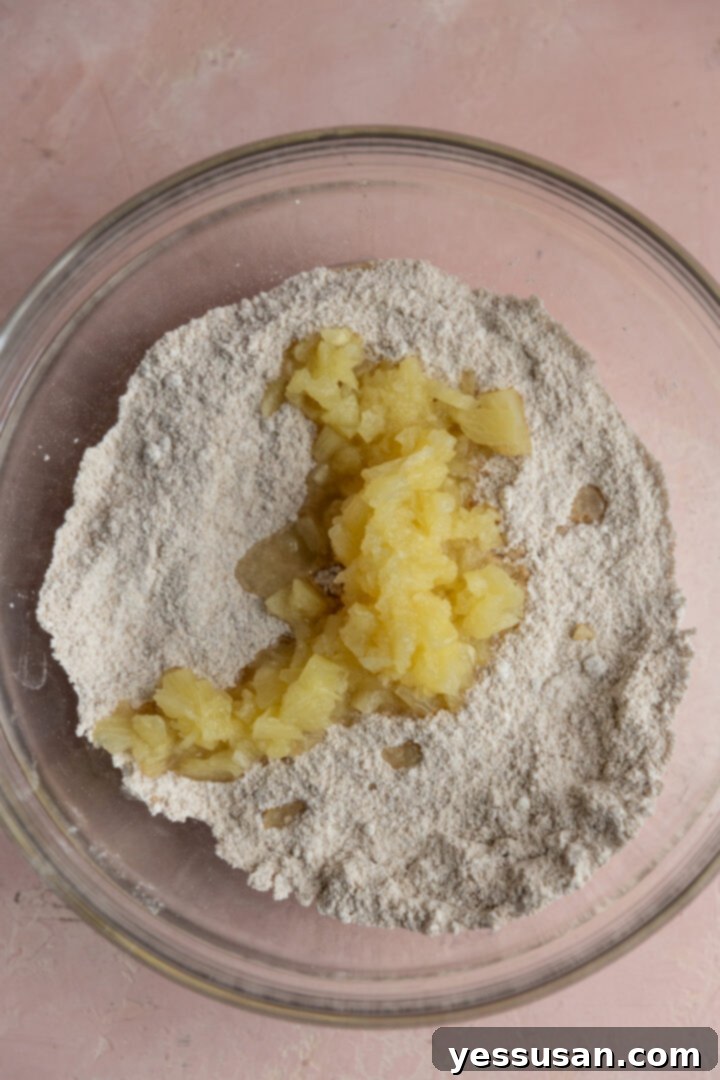 Pineapple-Packed Carrot Cupcake Delights 4 Crushed pineapple added to dry ingredients.