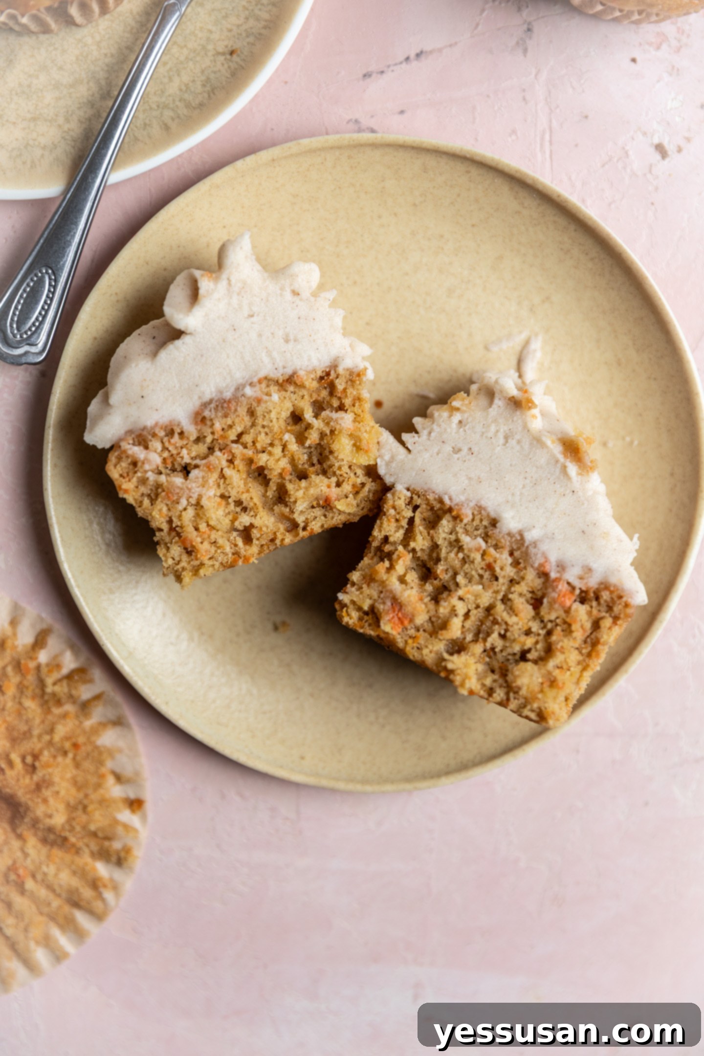 Pineapple-Packed Carrot Cupcake Delights 8 A carrot cake cupcake with pineapple split in the middle