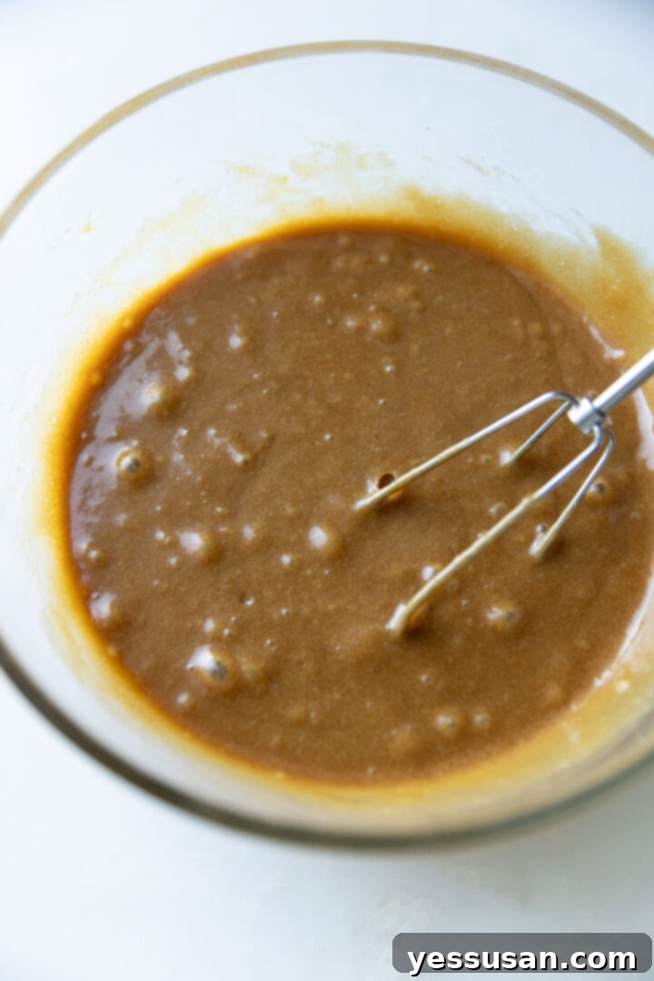 Moist Carrot Loaf: Simple Baking Perfection 5 Wet batter for the carrot cake loaf, smooth and ready for dry ingredients.