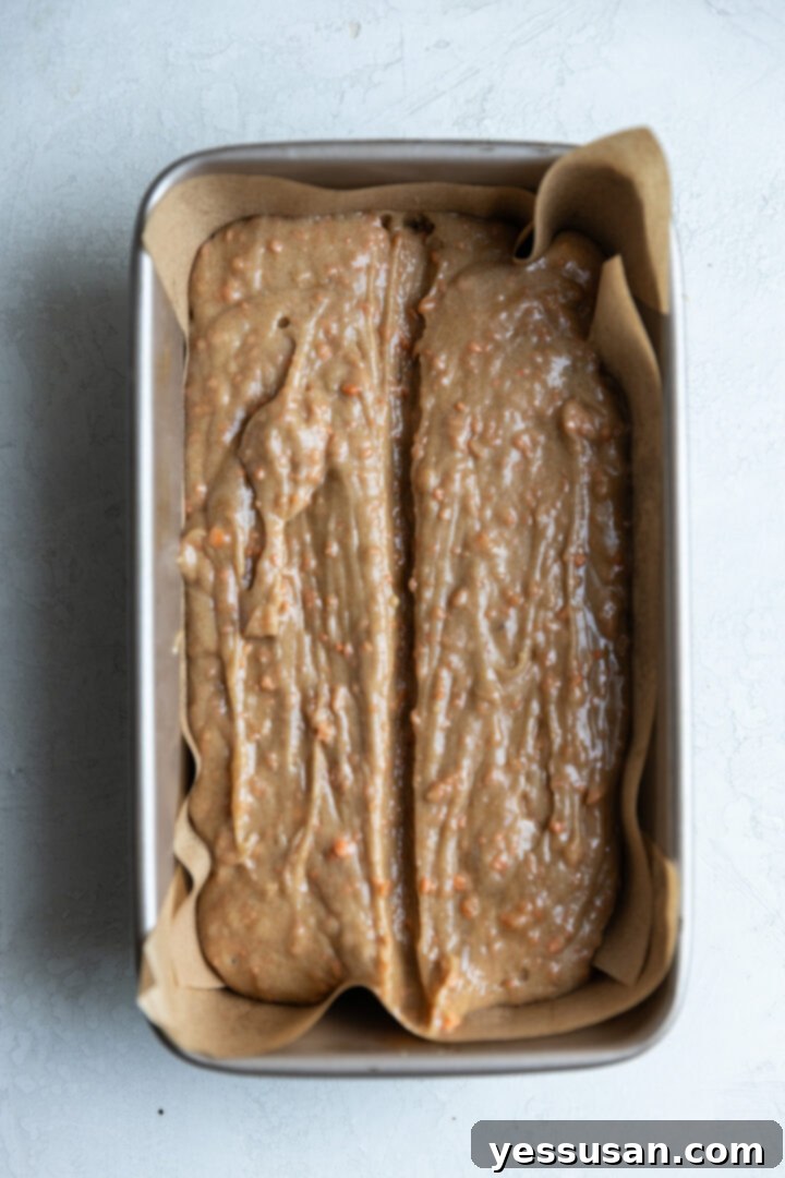 Moist Carrot Loaf: Simple Baking Perfection 7 Carrot cake loaf batter poured into a prepared loaf pan.
